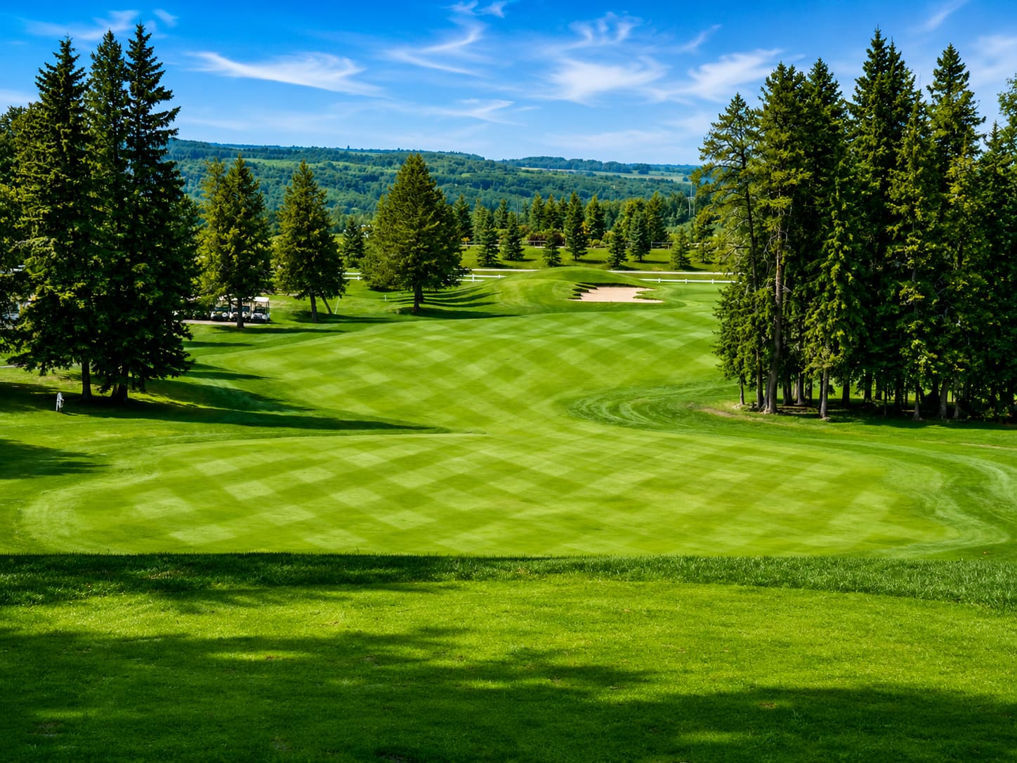Elevated tee box with Battle River valley view at Dorchester Ranch